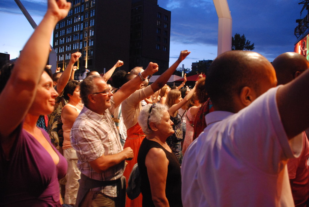 Pre-ebola solidarity: Montreal residents and visitors at one with the West African musicians on stage at the 2013 Festival International Nuits Africain.