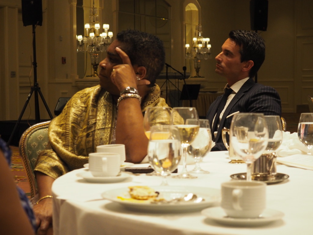 Bermuda's Works Minister Pat Gordon-Pamplin and ruling party Senator Jeff Baron listen to Ewart Brown's keynote address at the annual Labour Day banquet