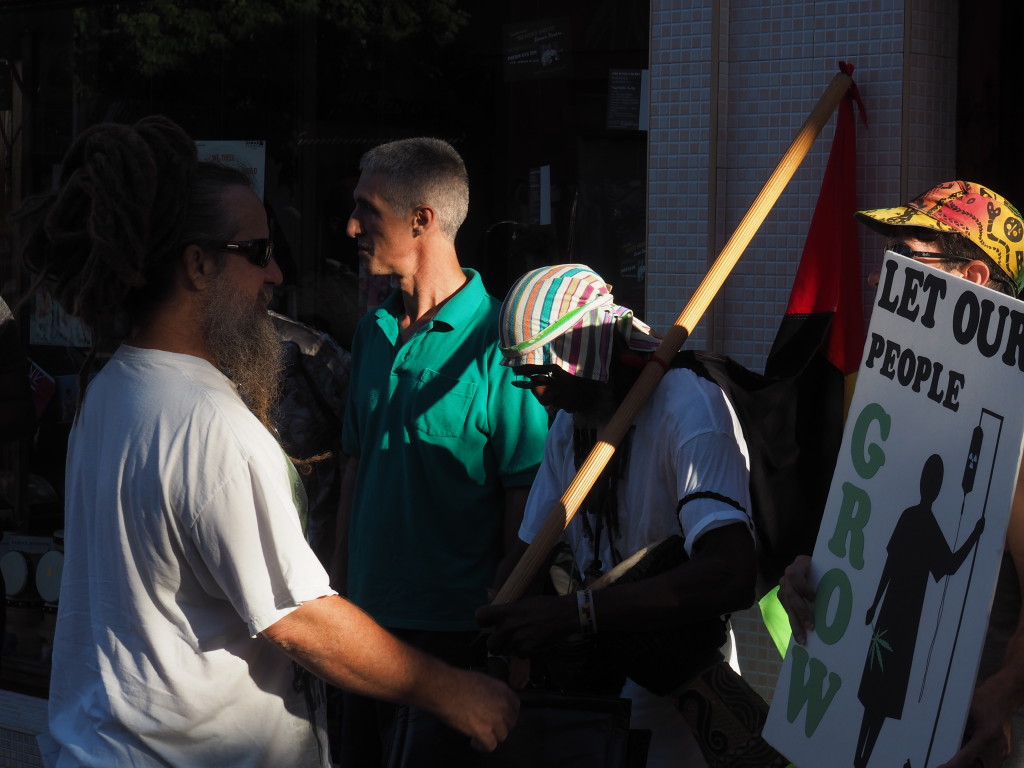 Alan Gordon (in green shirt) leads  a protest calling for more open access to marijuana for medical purposes outside the headquarters of Bermuda's governing One Bermuda Alliance. 